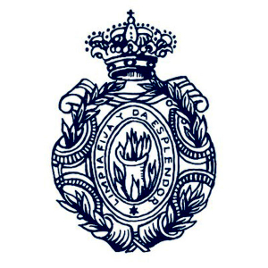 Escudo de la rae. En el centro hay un crisol con fuego. El lema es: Limpia, fija y da esplendor.